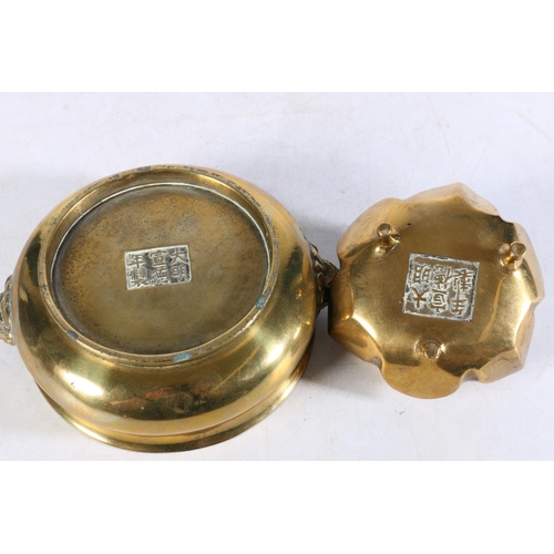 505 - Two Chinese brass censors, one with Kylin head handles and six character mark to base, 14cm diameter... 