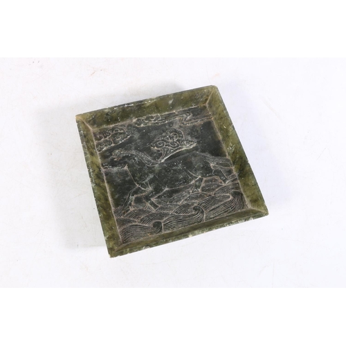 508 - 20th Century hardstone panel or dish of square form depicting a galloping horse, 14.5cm.