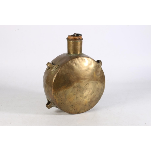 511 - Brass middle eastern pilgrim or saddle flask with fitted oak stopper and four loop handles, 18cm tal... 