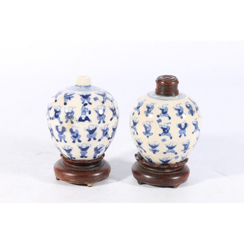 514 - Pair of 19th Century Chinese miniature spherical blue and white vases decorated with the 100 childre... 