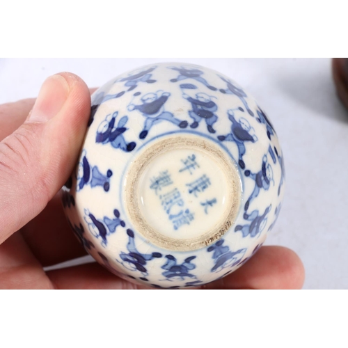 514 - Pair of 19th Century Chinese miniature spherical blue and white vases decorated with the 100 childre... 