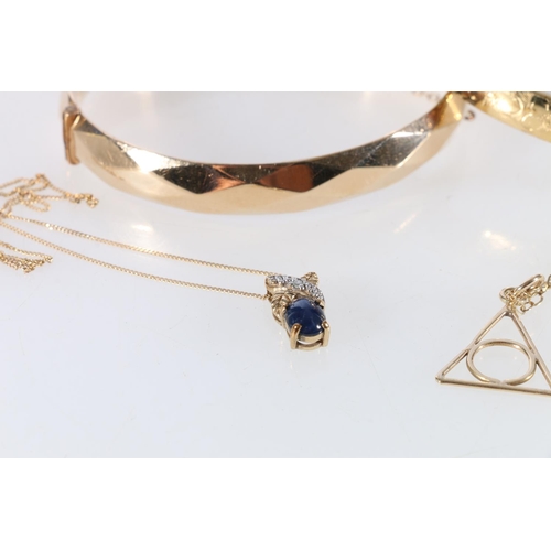 70 - Two 9ct gold pendants on 9ct gold chains, 4.4g, and two 1/5 9ct rolled gold bangles, one Georg Jense... 