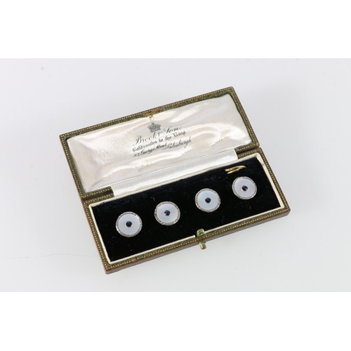 76 - 18ct gold sapphire and mother-of-pearl set four stud set, in Brook & Son of Edinburgh box, 4g.