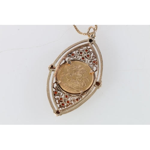 77 - 1892 sovereign in red stone set yellow metal pendant, on 14ct gold chain, 25.2g gross.