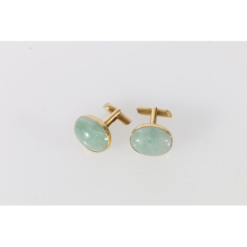 80 - Pair of 18ct and hardstone set (possibly jade) gent's cufflinks, 15.3g.