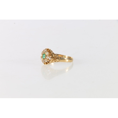 83 - Unhallmarked Victorian gold, diamond and emerald set flower-head ring, the central emerald surround ... 