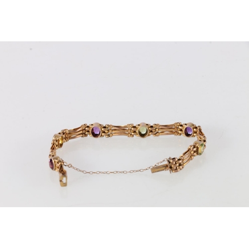 87 - 9ct gold amethyst and peridot set lady's bracelet, 17cm long, 14.3g.