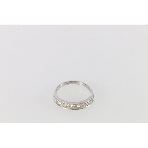 92 - Platinum and diamond eight stone half eternity rings, 'Jack to Maimie 13/2/64, size R, 4.1g.