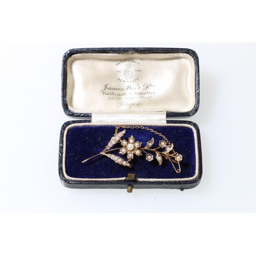 103 - 9ct gold lily-of-the-valley style seed pearl spray brooch, 3.8g in James Weir Ltd leather box.