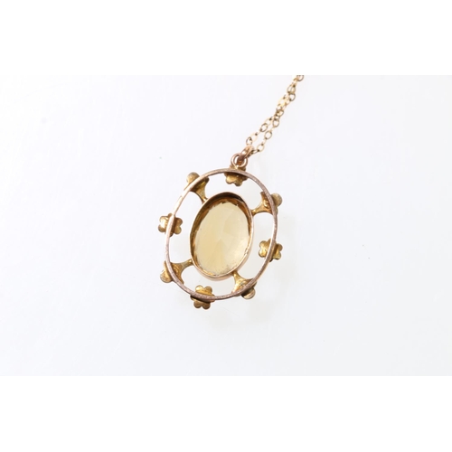 104 - 9ct gold seed pearl and citrine pendant on 9ct gold necklace, with barrel closure, 5.5g.