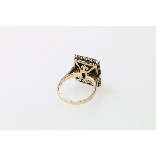 114 - 18ct gold diamond ring set with central baguette cut stone, London, size O, 7.6g.