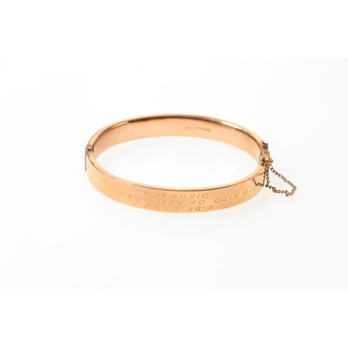 119 - 9ct rose gold half engraved foliate snap-shut bangle, 10.5g.