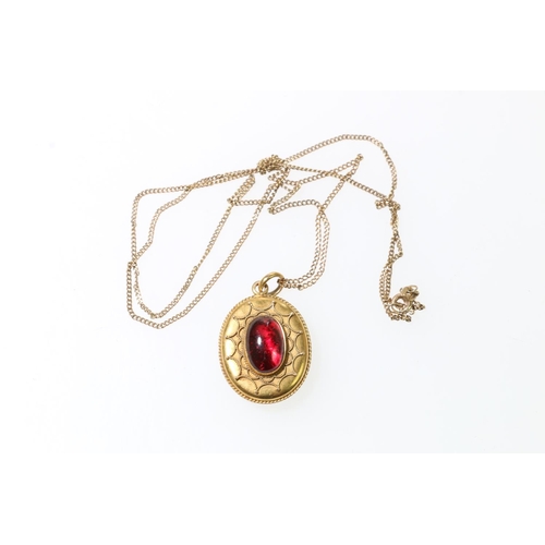 129 - 9ct gold necklace, with yellow metal mourning locket set with single red cabochon, 66cm long, 10.1g ... 