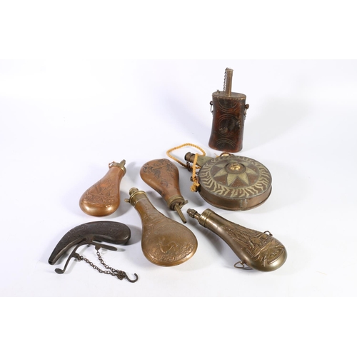 491 - Four Victorian brass and copper powder flasks, an Indian brass mounted wooden powder flask and an an... 