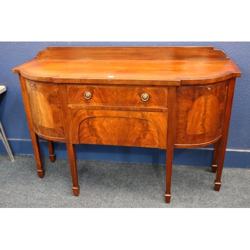 557 - Antique mahogany break-front sideboard, having ledge-back cross-banded sides, raised on square taper... 