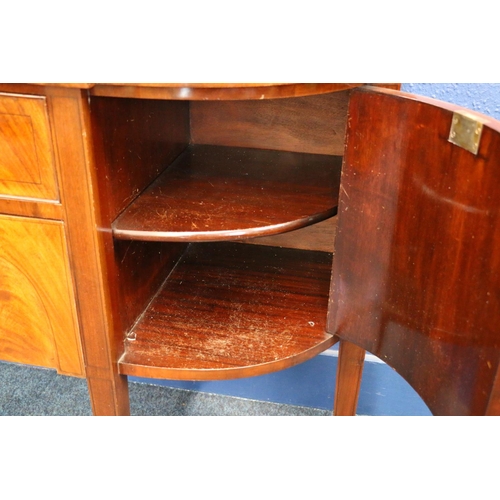 557 - Antique mahogany break-front sideboard, having ledge-back cross-banded sides, raised on square taper... 