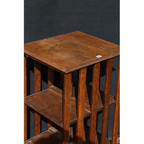 562 - Late Victorian oak revolving bookcase of typical design, 93cm high.