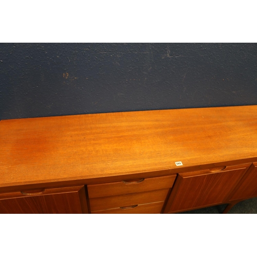 565 - Grieves & Thomas mid-century teak sideboard, having three graduated drawers flanked by cupboards... 