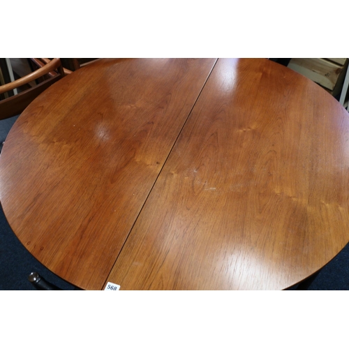 568 - Mackintosh of Kirkcaldy circular teak extending dining table, raised on straight supports, 123cm dia... 