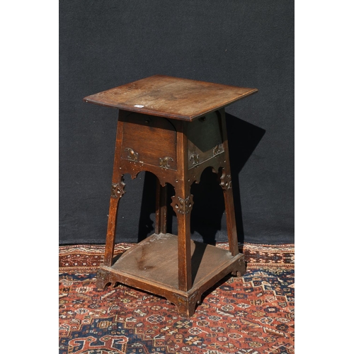 570 - Art Nouveau carved oak worktable, in the manner of Liberty's, the base with four fall front cupboard... 