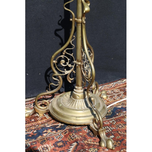 571 - Art Nouveau brass telescopic standard lamp, raised on paw supports, the underside with reg. no. 4108... 