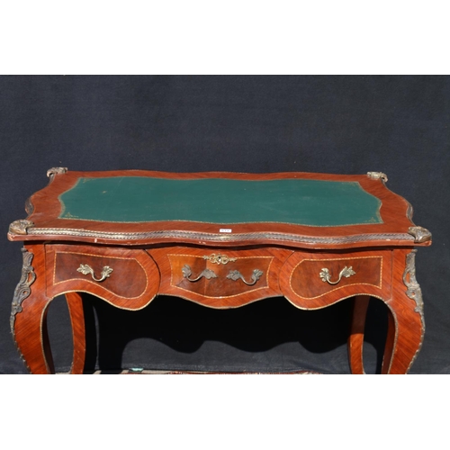 572 - Reproduction French bureau plat, with Kingswood veneer and faux ormolu mounts, raised on cabriole su... 