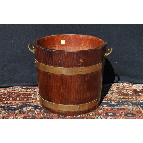 574 - Coopered oak brass bound peat bucket, with maker's roundel for R A Lister & Co. Ltd, 33cm high.