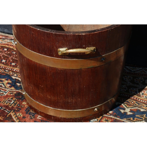 574 - Coopered oak brass bound peat bucket, with maker's roundel for R A Lister & Co. Ltd, 33cm high.