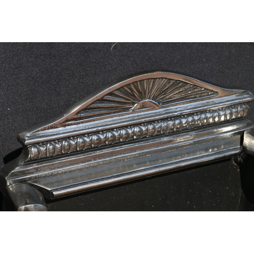 575 - Chromed cast metal fire basket of classical design, upon cabriole supports, terminating in whorl fee... 