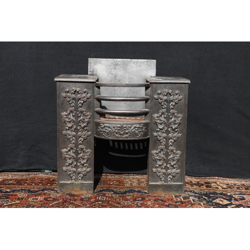 576 - In the manner of William Burges, an antique cast fire basket, with relief floral decoration, 60cm wi... 