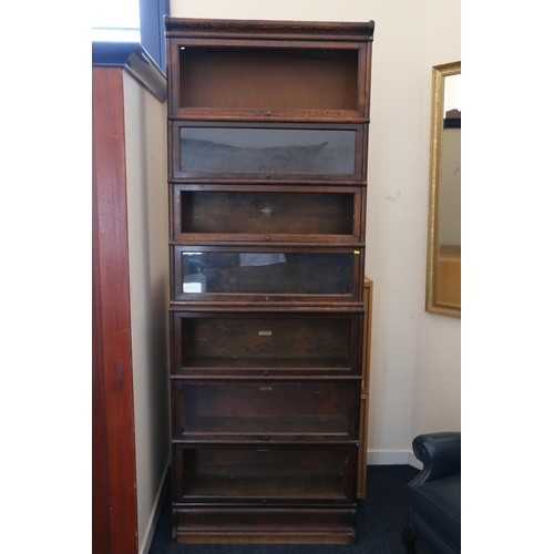 579 - Globe Wernicke oak seven section stacking bookcase, 235cm high.