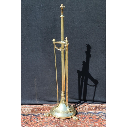 588 - Art Nouveau brass telescopic standard lamp, raised on three paw feet, having swag decoration, 140cm ... 