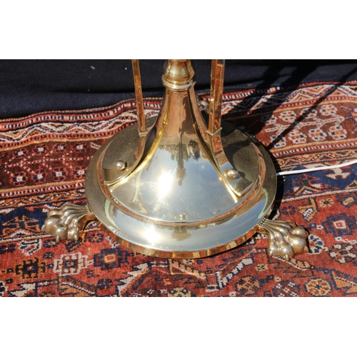 588 - Art Nouveau brass telescopic standard lamp, raised on three paw feet, having swag decoration, 140cm ... 