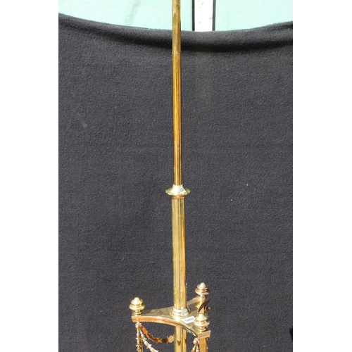 588 - Art Nouveau brass telescopic standard lamp, raised on three paw feet, having swag decoration, 140cm ... 