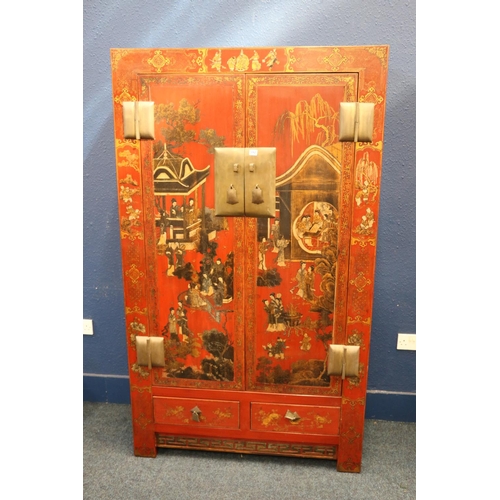 592 - Oriental lacquered two door wardrobe, decorated with figures in a pavilion and traditional scenes, h... 