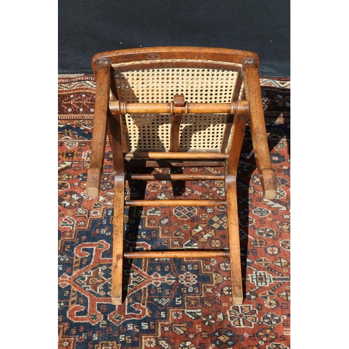 596 - Late Victorian folding chair, having single caned bergere seat.