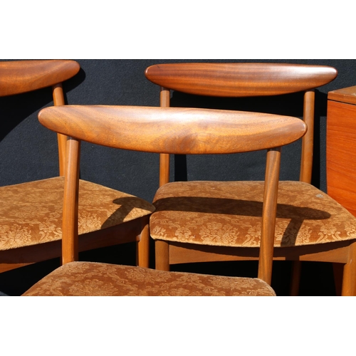 597 - Set of four mid-century teak (simulated rosewood) side chairs, having boomerang backs, raised on tur... 