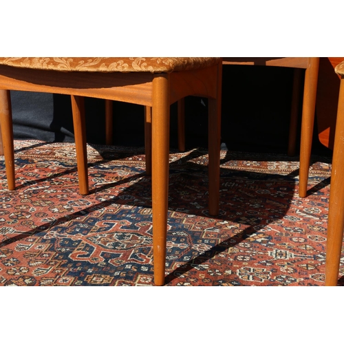 597 - Set of four mid-century teak (simulated rosewood) side chairs, having boomerang backs, raised on tur... 