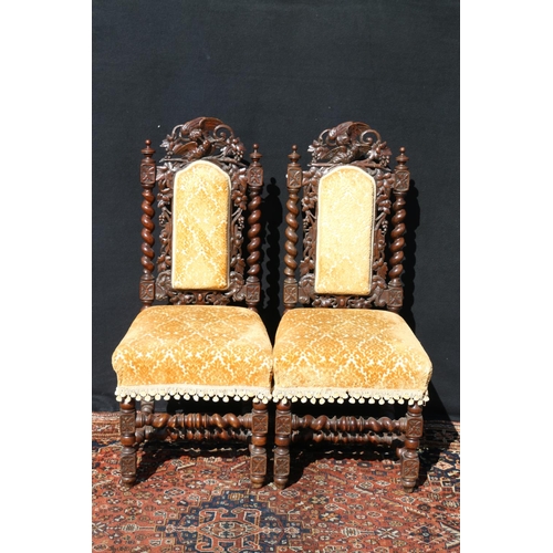 598 - Pair of carved oak Elizabethan style side chairs, the top rail modelled as a pair of birds and fruit... 