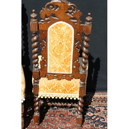 598 - Pair of carved oak Elizabethan style side chairs, the top rail modelled as a pair of birds and fruit... 