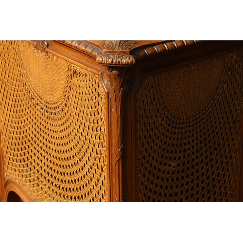 603 - Early 20th century French style walnut hinge-top wine cooler, having ornate bergere work panels, rai... 