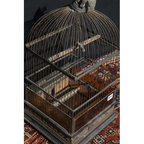 604 - Arts & Crafts French style bird cage of typical form, having inset glass panels, and repousse br... 