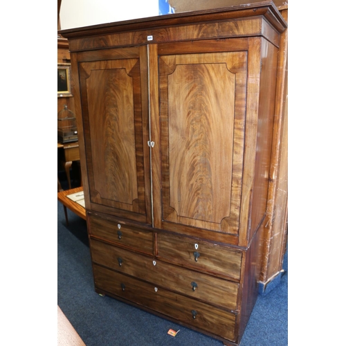 605 - Georgian mahogany and ebony strung two door linen press, the cornice with moulded top, above four dr... 