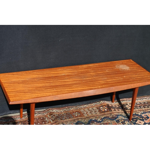 610 - Gordon Russell Limited of Broadway Worcester, a teak coffee table, 121cm long.