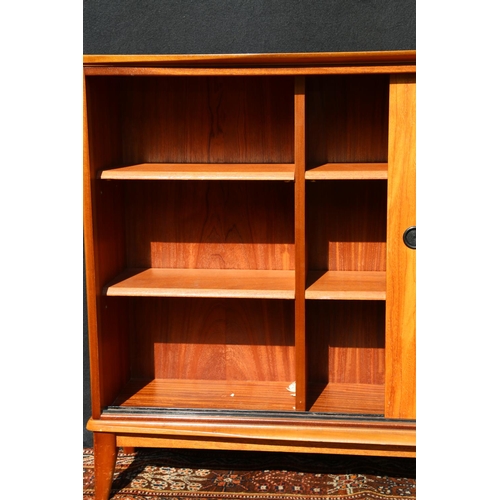 614 - Mid century teak sliding door bookcase, unattributed, 140cm long.