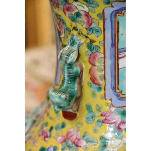 471 - Canton famille rose vase with Dog of Fo handles, the yellow and green ground with foliate, horse and... 