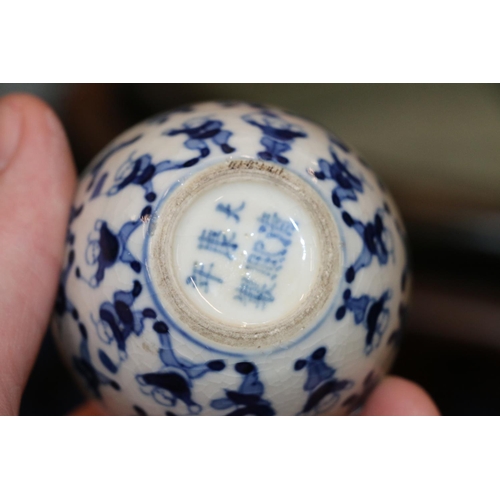 514 - Pair of 19th Century Chinese miniature spherical blue and white vases decorated with the 100 childre... 