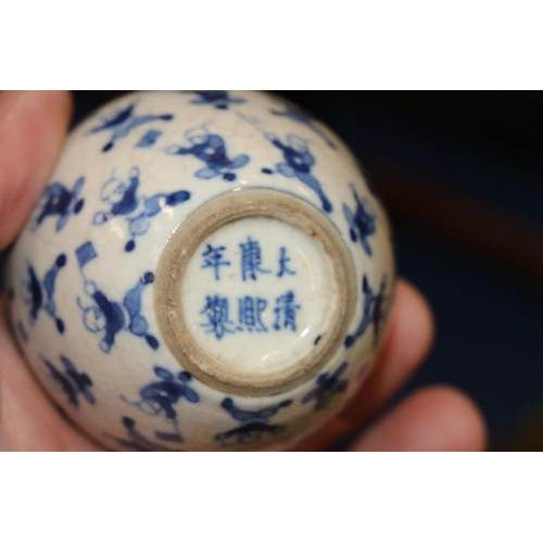 514 - Pair of 19th Century Chinese miniature spherical blue and white vases decorated with the 100 childre... 