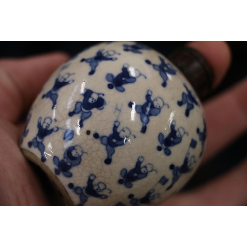 514 - Pair of 19th Century Chinese miniature spherical blue and white vases decorated with the 100 childre... 