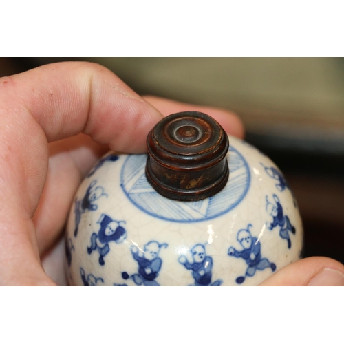 514 - Pair of 19th Century Chinese miniature spherical blue and white vases decorated with the 100 childre... 